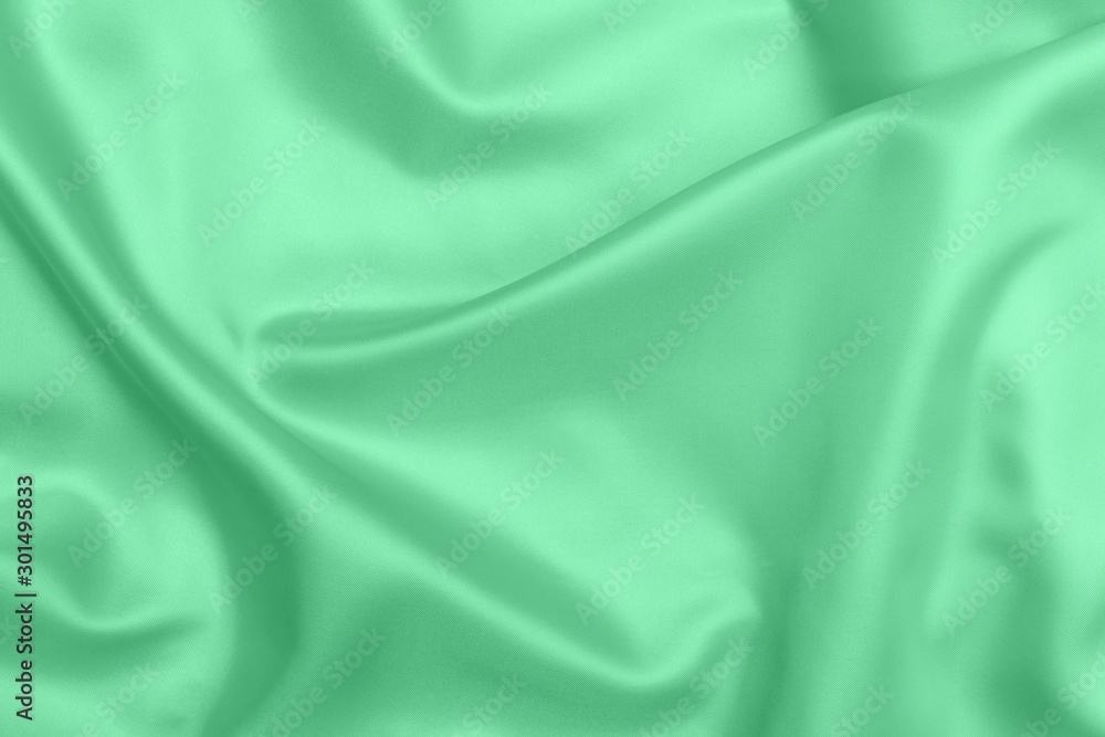 Fototapeta premium green satin fabric texture soft blur background