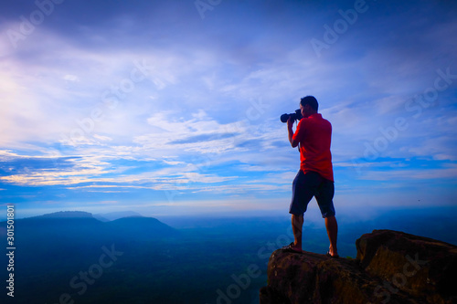 tourist Taking photos of the fog on the top of the mountain, relaxing, nature traveling concept.