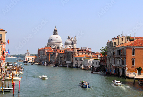 Grand Canal and the church Basilica di Santa Maria della Salute from the Academia bridge on summer. Venice, Italy.