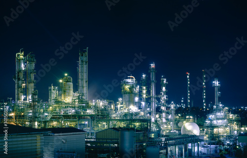 Glitter lighting of petrochemical plant with night, Manufacturing of petroleum industrial plant