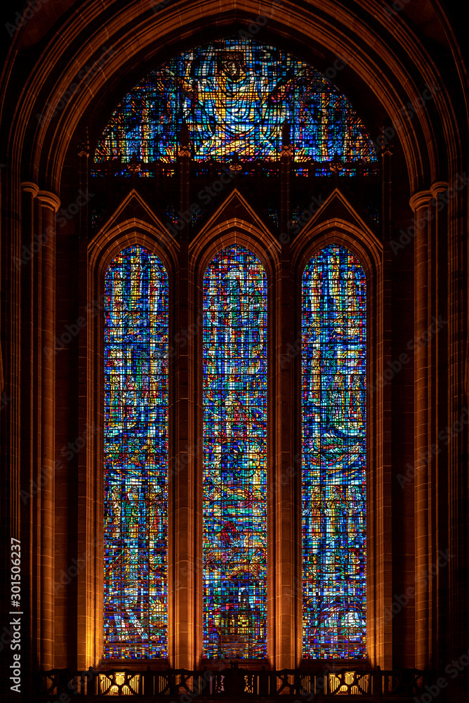 LIVERPOOL, ENGLAND, DECEMBER 27, 2018: Entrance stained glass from interior of the Church of England Anglican Cathedral of the Diocese of Liverpool.
