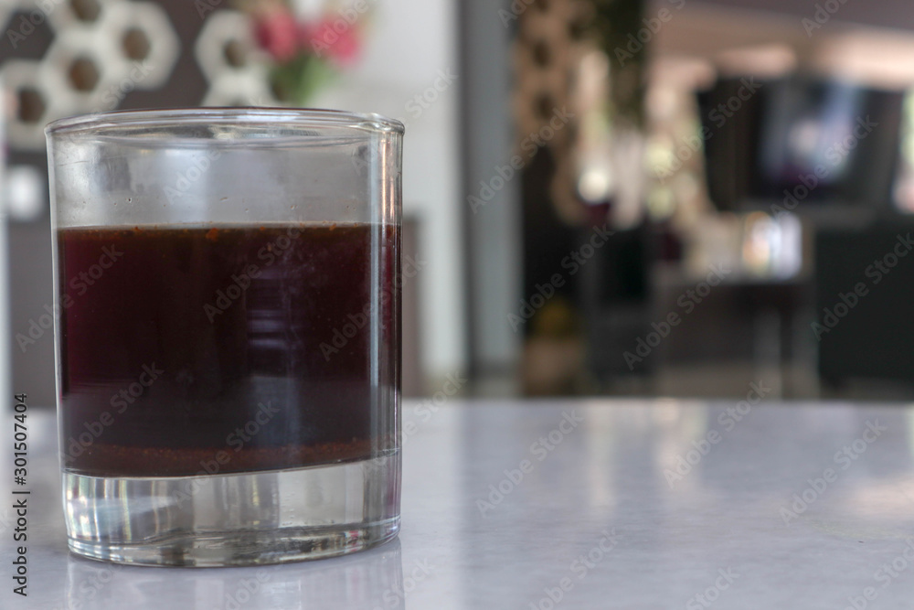 old fashioned glass of black coffee in the hotel and cafe in the afternoon and evening - segelas kopi hitam  di hotel dan cafe pada sore dan malam hari