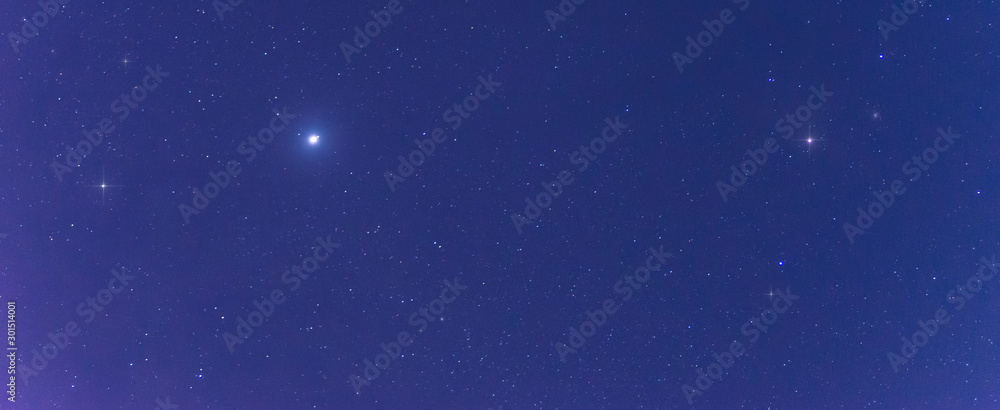 Fototapeta premium Panorama blue night sky milky way and star on dark background.Universe filled with stars nebula and galaxy with noise and grain.Photo by long exposure and select white balance.Dark night sky.