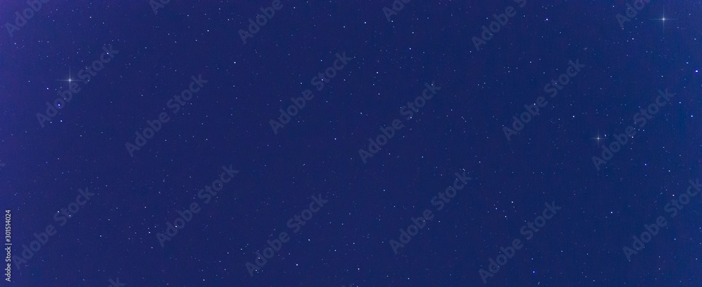 Panorama blue night sky milky way and star on dark background.Universe filled with stars  nebula and galaxy with noise and grain.Photo by long exposure and select white balance.Dark night sky.