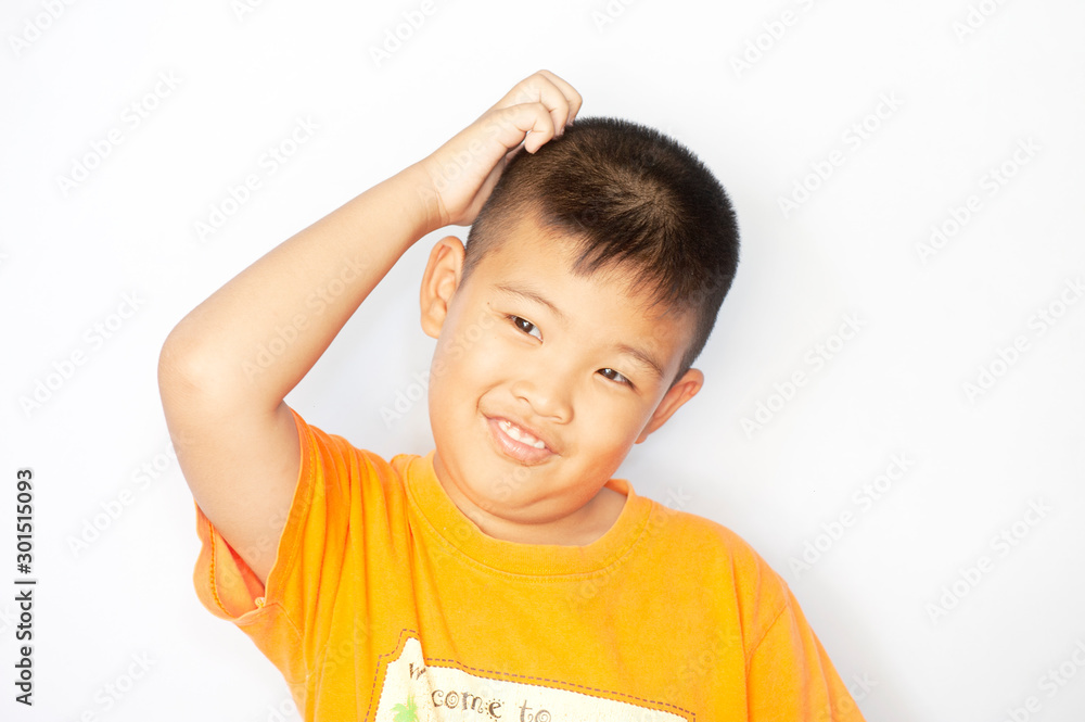 Feelings Emotions and States of Mind of young asian boy scratching his head thinking over white background Feelings Emotions and States of Mind of young asian boy scratching his head thinking over white background