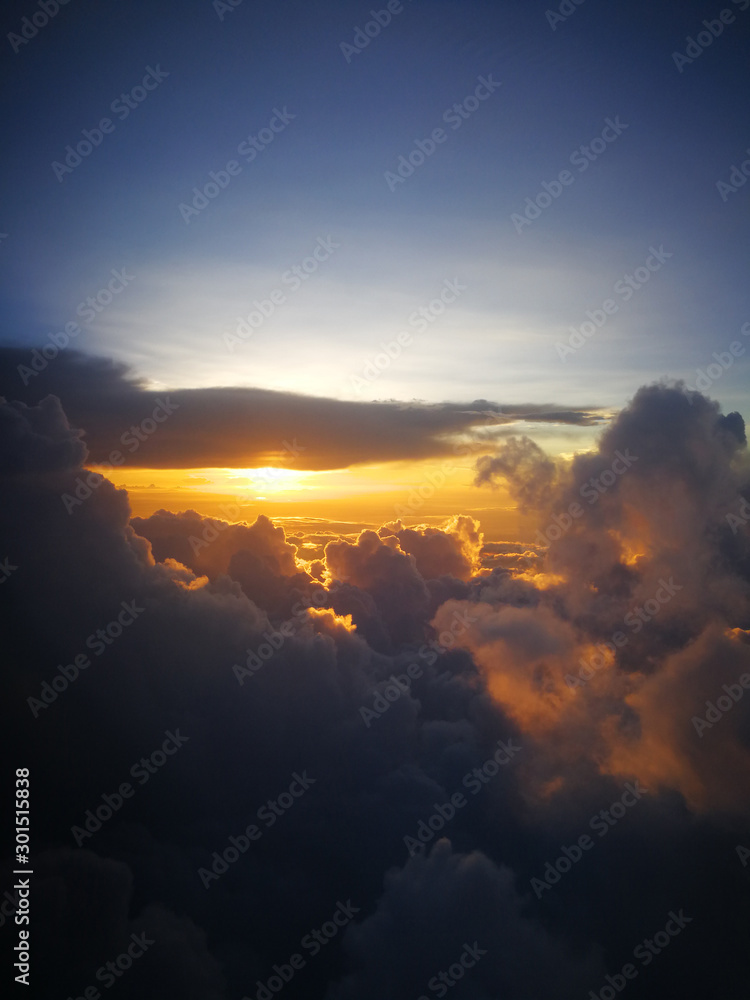 The airplane window. The clouds taken on the plane.The airplane window. The clouds taken on the plane.Beautiful sky picture taken from the plane.