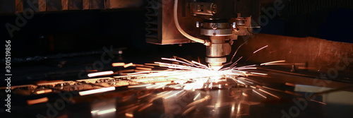 Sparks fly out machine head for metal processing