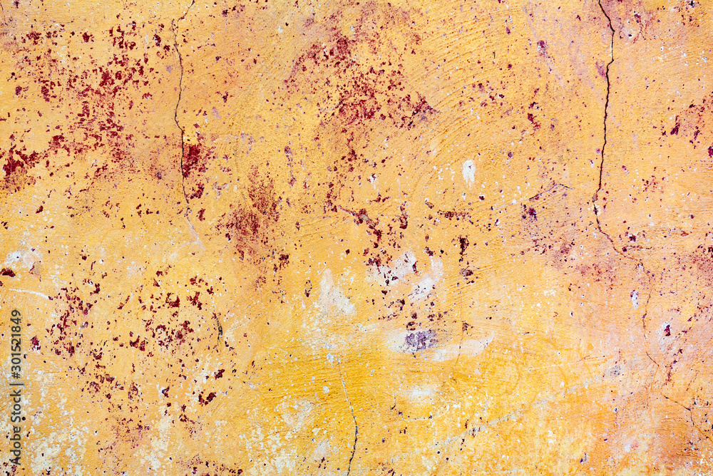 Texture of a concrete wall with cracks and scratches which can be used as a background Texture of a concrete wall with cracks and scratches which can be used as a background