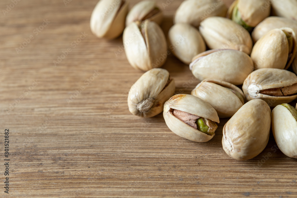 Close-up Pistachio nut on wood background Close-up Pistachio nut on wood background