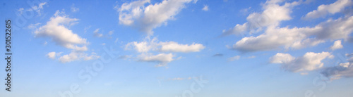 Fototapeta Naklejka Na Ścianę i Meble -  Panoramic view of blue summer sky with white clouds or cloudscape.