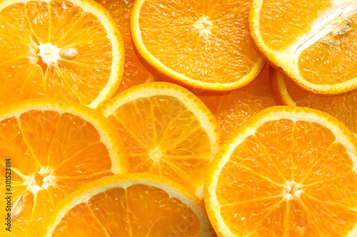 slice of bright color oranges. Texture background ripe juicy fruits oranges. Product Image Tropical Oranges Fruit