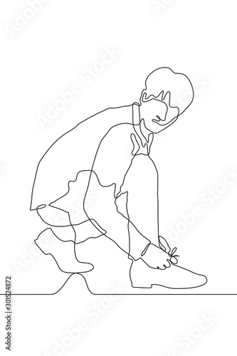 continuous one line drawing of a young handsome full-length man in casual clothes tie a lace. Preparation, planning, strategy, shoe problems, sports, observation. Can be used for animation. Vector