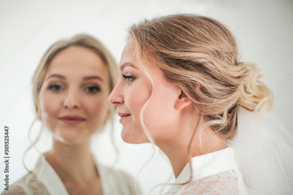 Beautiful young girl tries on the image of the bride Beautiful young girl tries on the image of the bride