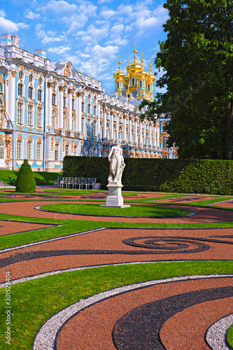 Statue and the Catherine Palace in a sunny weather. photo
