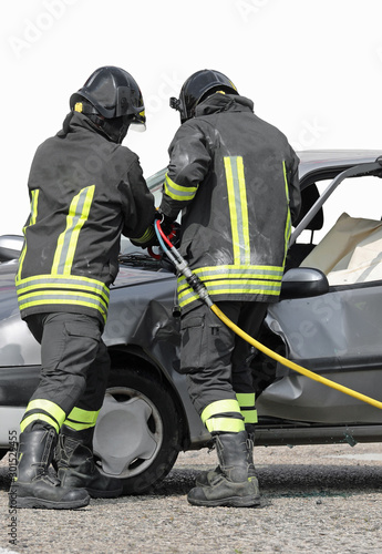 firefighters use a shear to open the car door