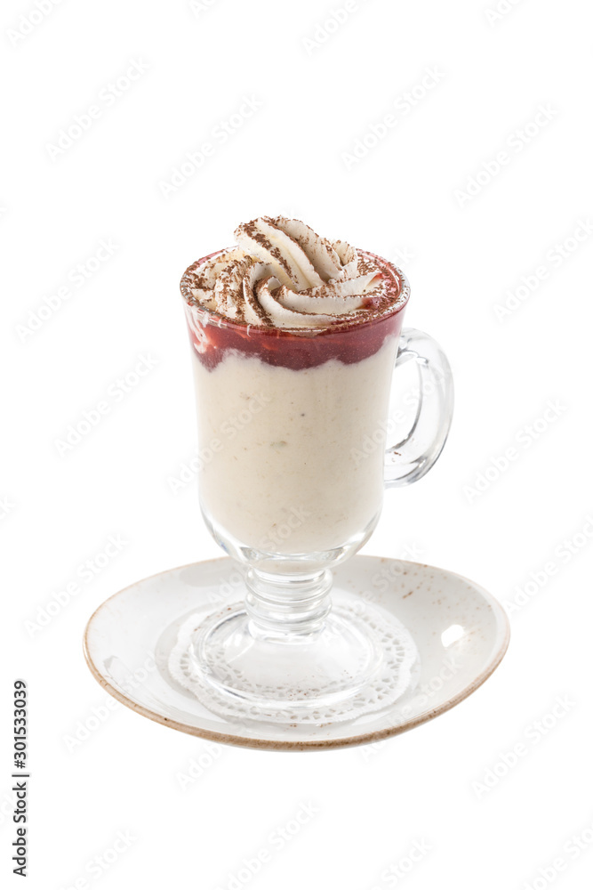 Delicious vanilla milkshake with strawberry topping and whipped cream in tall glass isolated on white background Delicious vanilla milkshake with strawberry topping and whipped cream in tall glass isolated on white background