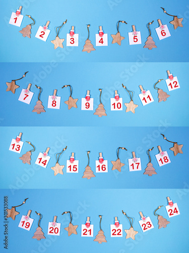 Creative collage of Advent calendar in gradient blue. Sheets with numbers and wooden christmas toys laid out as arcs.