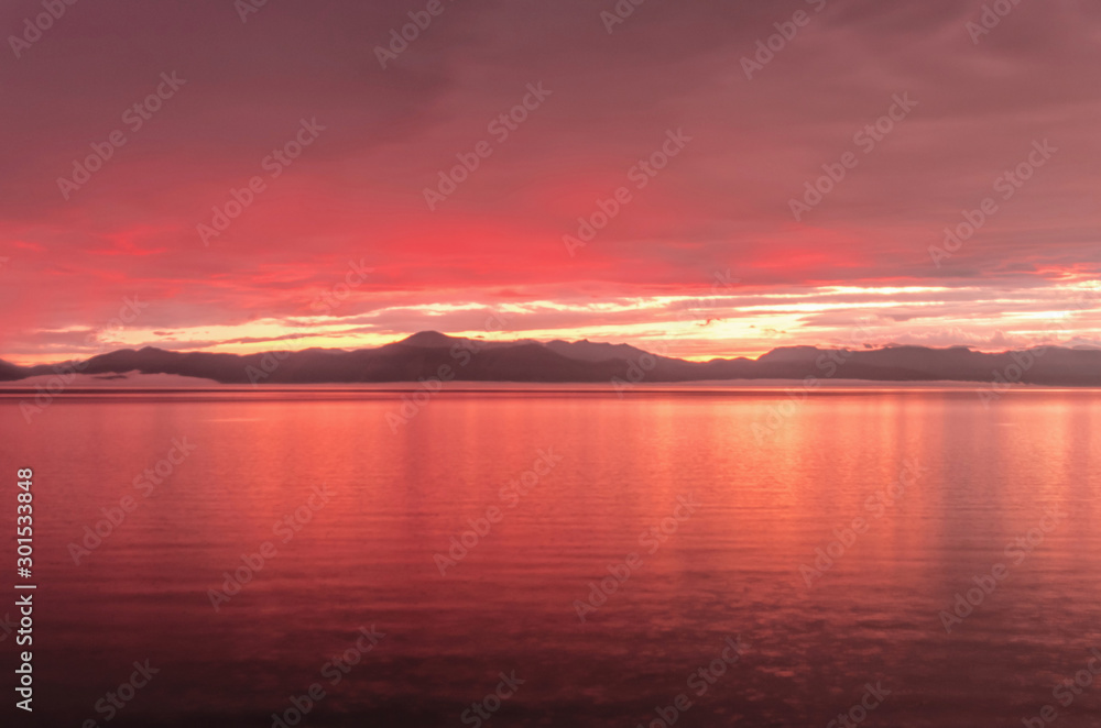 Rainy jrange red flamy sunset at Houbsougoul lake