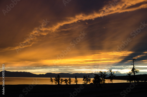 Rainy jrange red flamy sunset at Houbsougoul lake