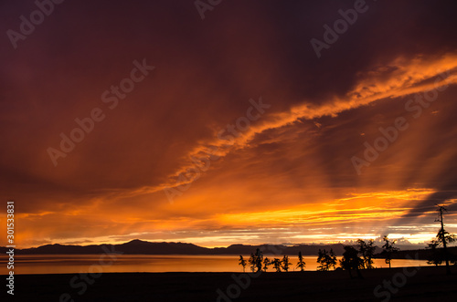 Rainy jrange red flamy sunset at Houbsougoul lake