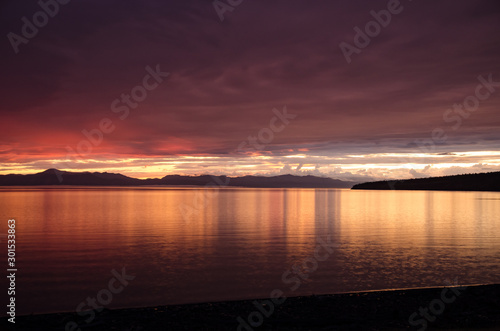 Rainy jrange red flamy sunset at Houbsougoul lake