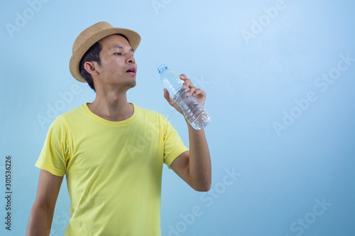 Thai asian man holding drink water. 