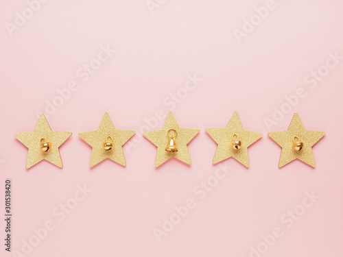 Five golden stars with bells  Christmas ranking concept