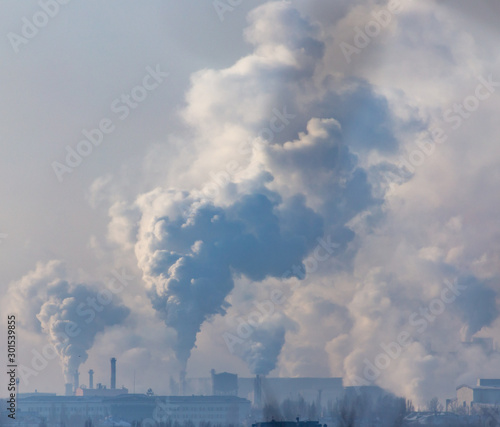 Smoke from the chimneys of a metallurgical plant at dawn