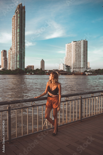 woman looking away during sunset in bangkok thailand