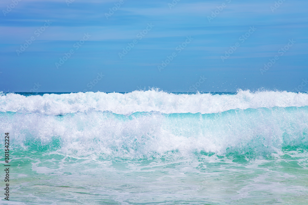 Blue Sea Wave with White Foam and Sky