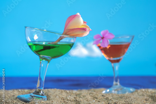 Summer day with cool cocktail on sea beach.