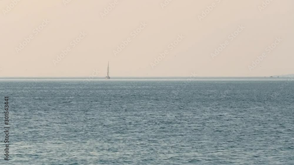 Sailboat and ocean horizon, misty and silvery 1 Sailboat and ocean horizon, misty and silvery 1