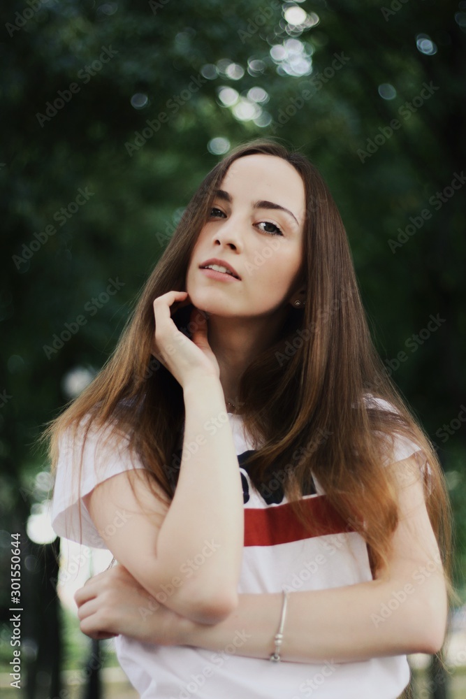 Young pretty girl walking down the street
