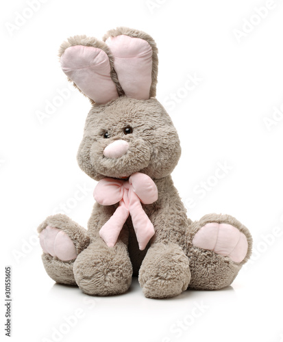 Old rabbit toy isolated on wood background