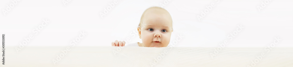 Baby and emotions. Little baby and place for text. Long poster.