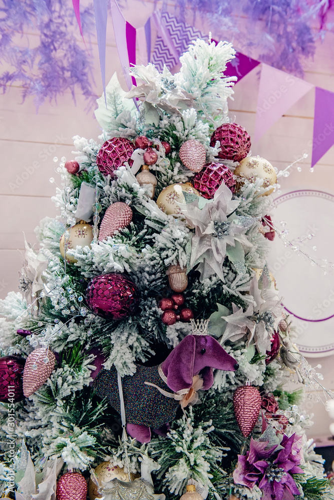 A fragment of Christmas-design Christmas tree ornaments and holiday rooms. Festive decoration of the room A fragment of Christmas-design Christmas tree ornaments and holiday rooms. Festive decoration of the room