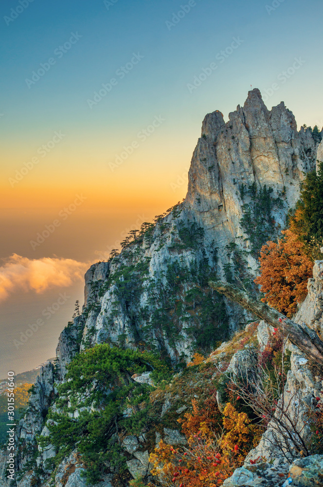 Majestic view of the rock on the background of clouds at dawn. Crimean mountains, AI-Petri
