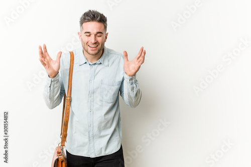 Young handsome business man joyful laughing a lot. Happiness concept.