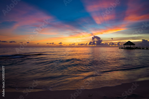 sun sea tropical sunset view of the pier of the caribbean © dbrus