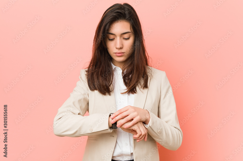 Young caucasian woman thinking about the time Young caucasian woman thinking about the time