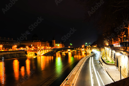 There are a night lights roads along Seine river in Paris