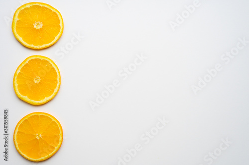 fresh orange slices on white background. space for text
