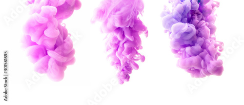 Set of abstract violet ink in water on a white background. It looks like smoke or cloud. Or zero gravity. photo