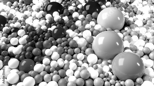 beautiful shiny balls of different colors and sizes completely cover the surface. Some spheres glow. 3d photorealistic render geometric reative holiday background of shiny balls