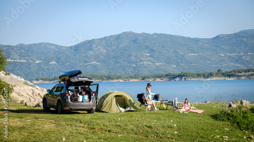 Adventures Camping tourism and tent and car next to the lake. Landscape outdoor in morning, Serbia.