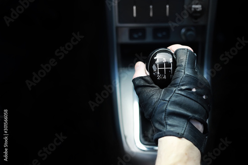 Gear lever. Manual Transmission. Hand on the gear shift in a car.