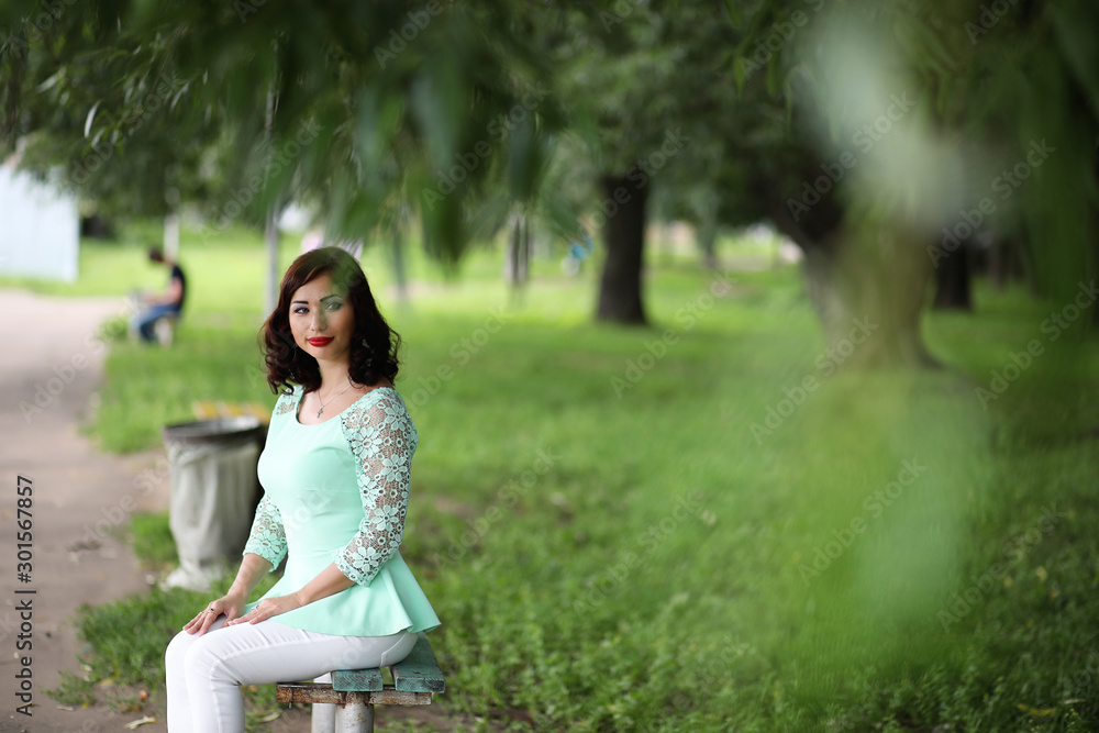 Beautiful girl in a spring leaf park Beautiful girl in a spring leaf park