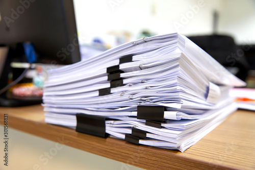 Pile of a lot papers documents on desk office stack up. photo