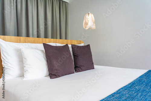 Fototapeta Naklejka Na Ścianę i Meble -  White pillow on bed decoration interior