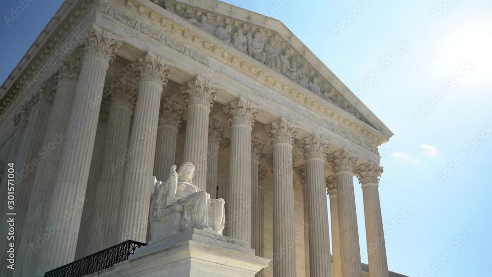 Supreme Court building and sculpture of Contemplation of Justice in Washington DC. Supreme Court building and sculpture of Contemplation of Justice in Washington DC.